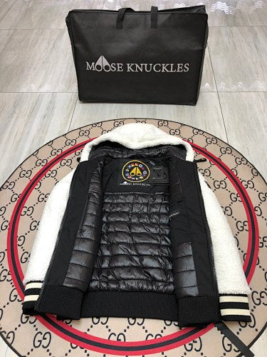 Moose Knuckles Black Down Puffer Jacket with White Sherpa Hood and Nautical Emblem Patch