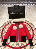 Moose Knuckles Red Down Parka with White Fur Hood and Pompom Zipper Pulls
