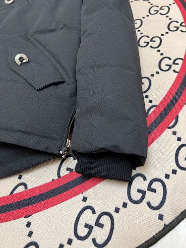 Moose Knuckles Black Down Parka with White Fur-Trimmed Hood and Silver Hardware