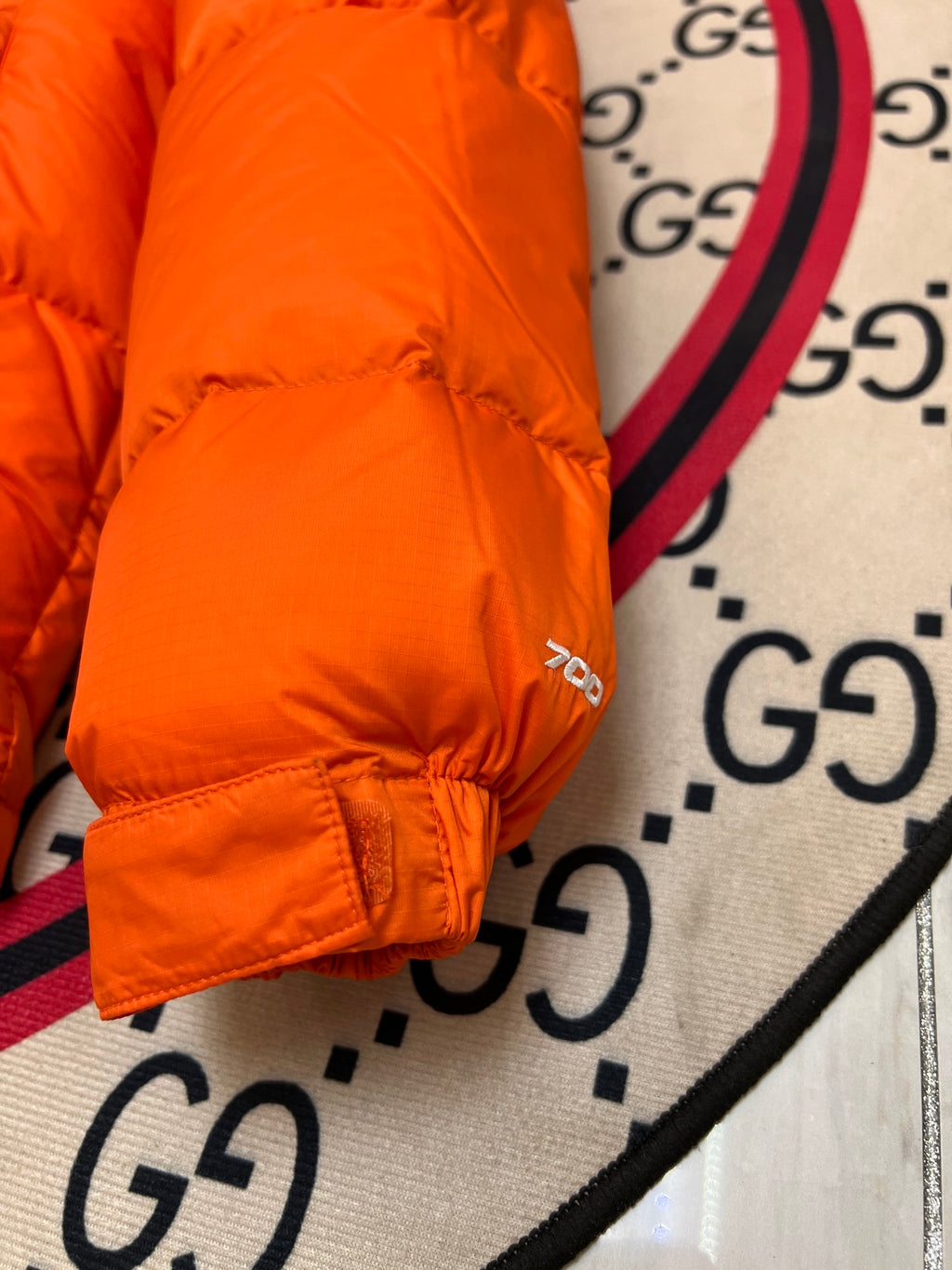 The North Face Orange Nuptse 700-Fill Down Jacket with Black Contrast Yoke