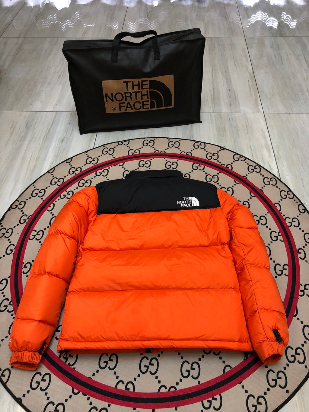 The North Face Orange Nuptse 700-Fill Down Jacket with Black Contrast Yoke