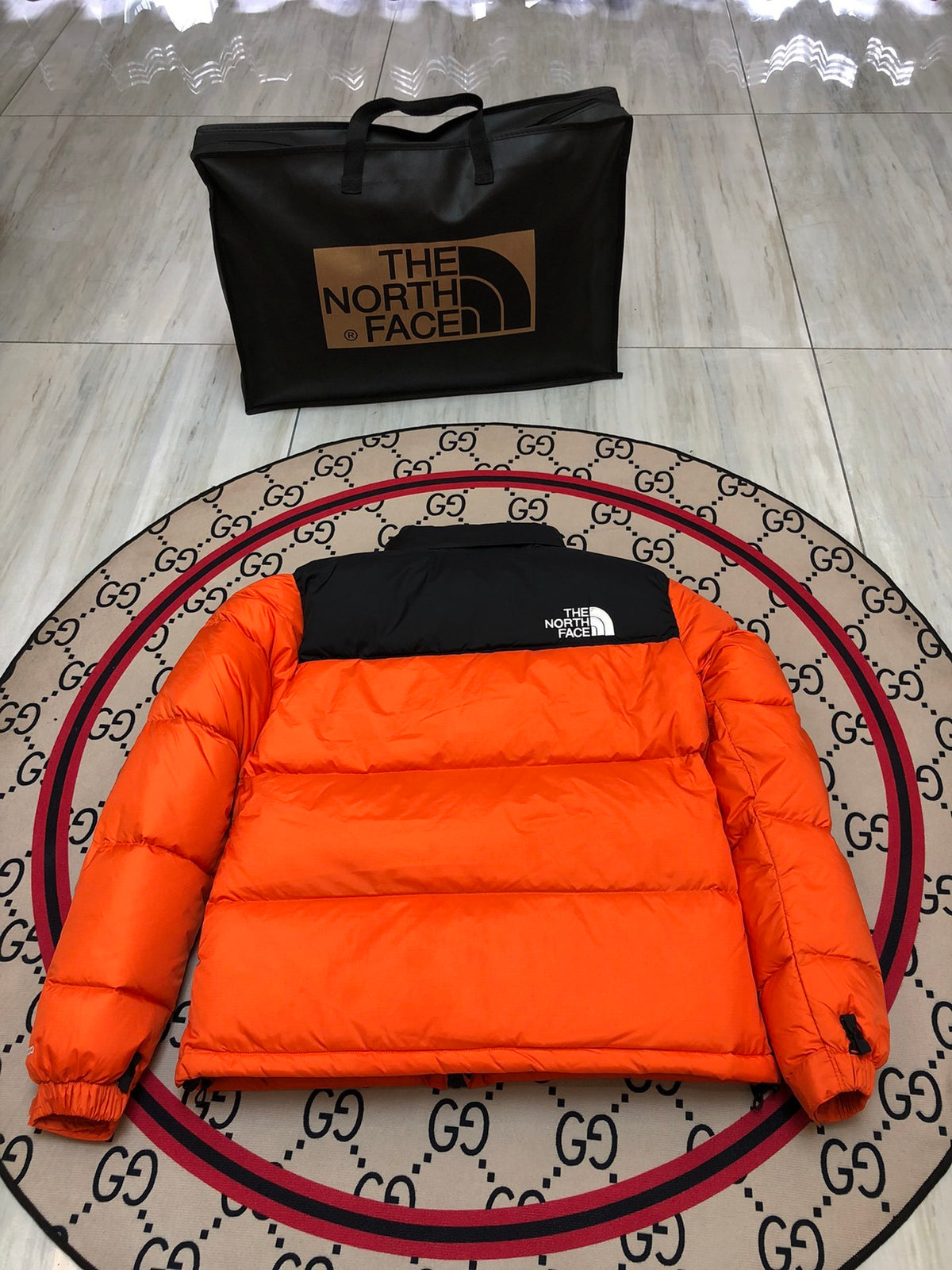 The North Face Orange Nuptse 700-Fill Down Jacket with Black Contrast Yoke