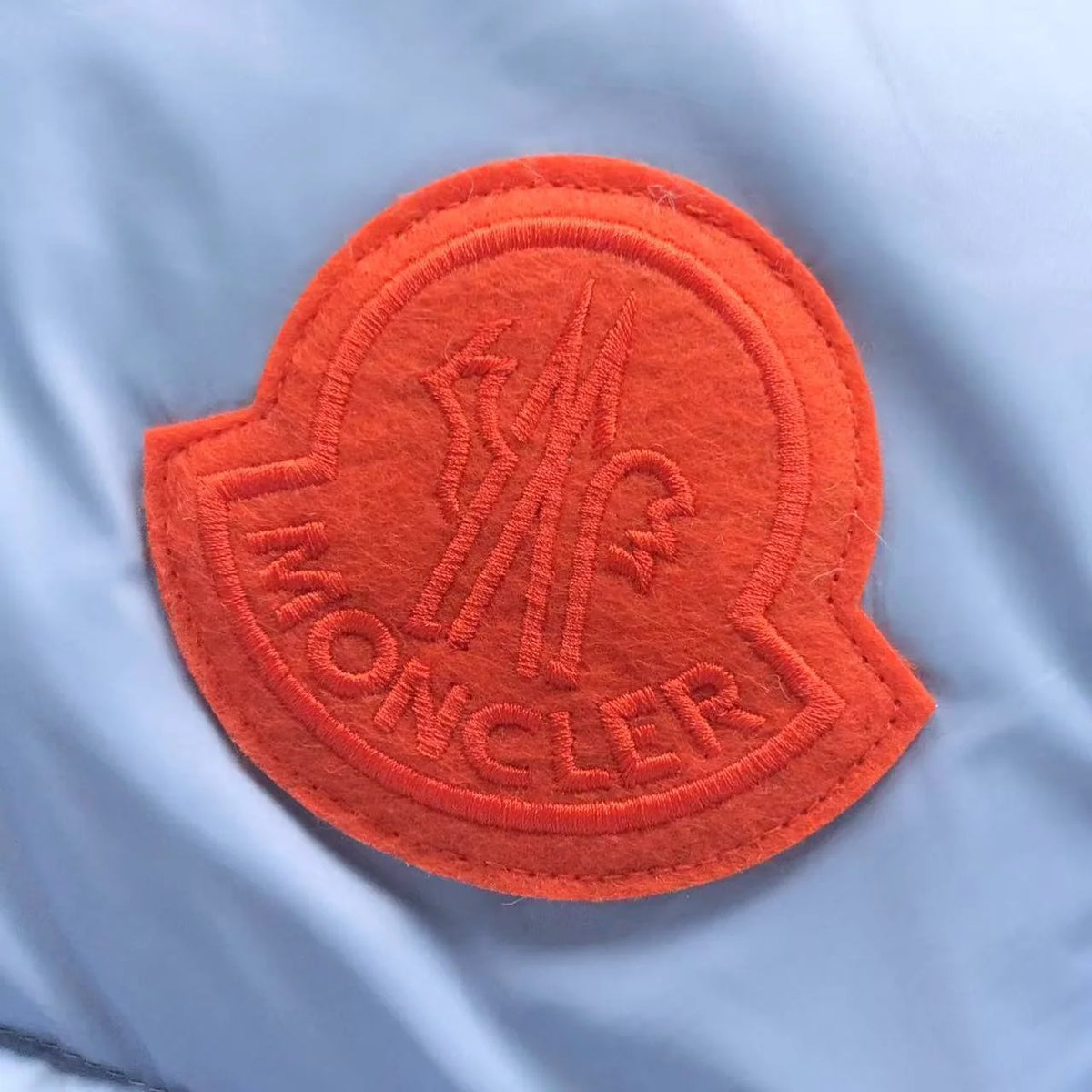 Moncler Ice Blue Hooded Puffer Jacket with Orange Logo Patch
